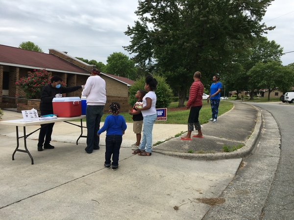 Residents taking advantage of getting free, hot meals in their community.