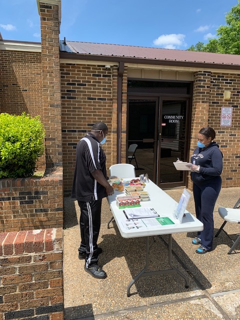 Man Getting Meals for Kids and Charlene Counts.