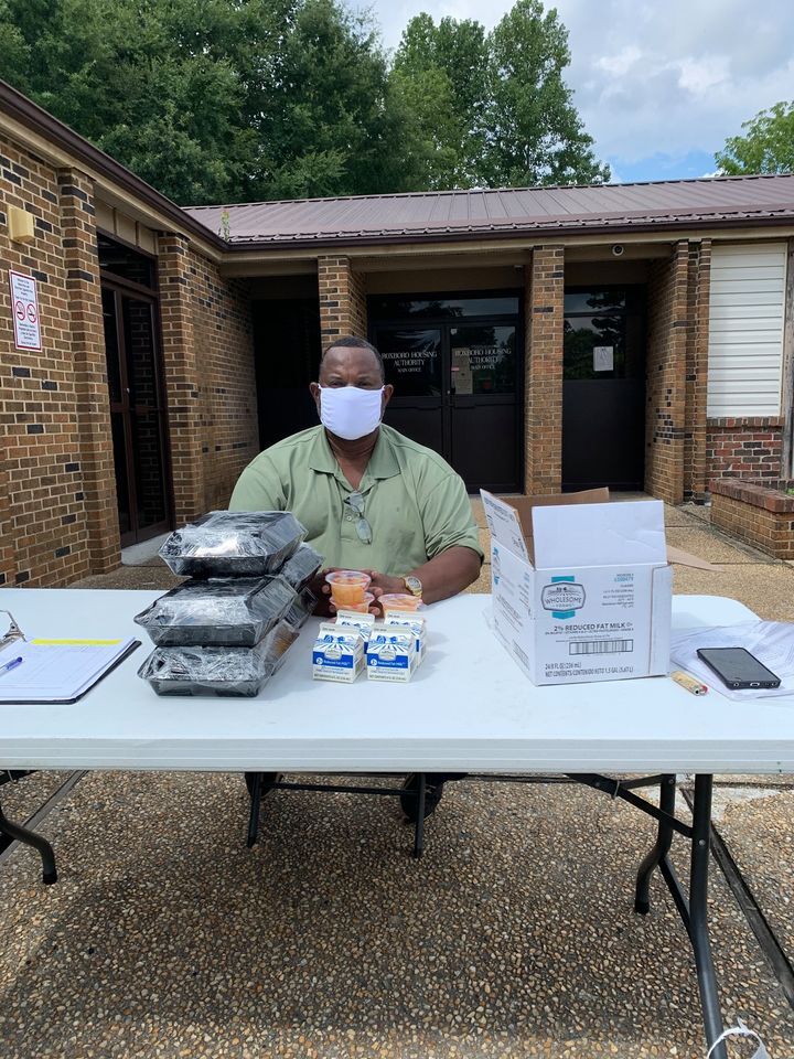 Coordinator Larry Mayfield Ready to Serve Hot Meals.