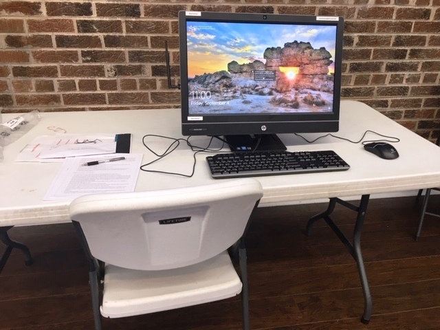A computer sitting on a table.