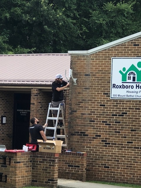 Crews Install WI FI Equipment.