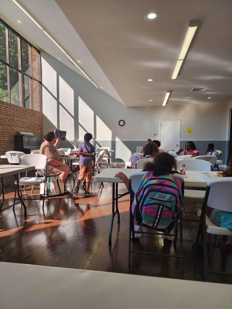 Kids Being Read to By Person Co Library Staff.