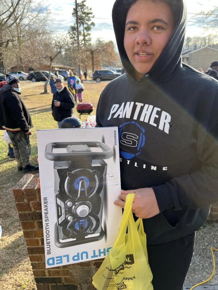 RHA Teen Gets Boom Box Speaker at 2022 RHA Christmas Party.