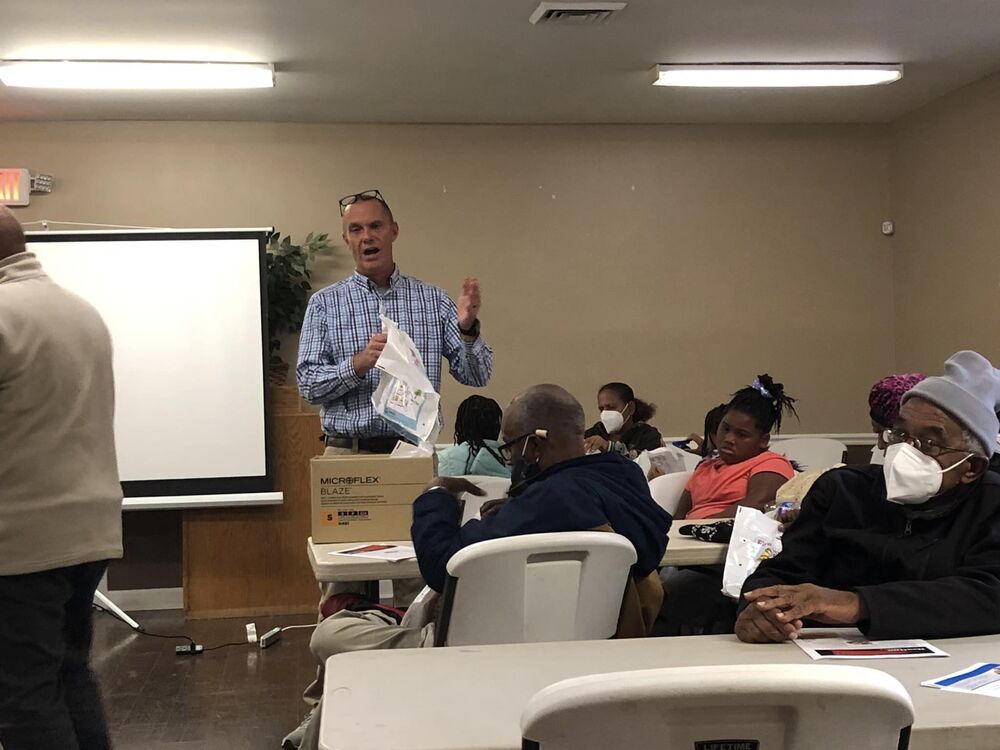 A man talking to a group.