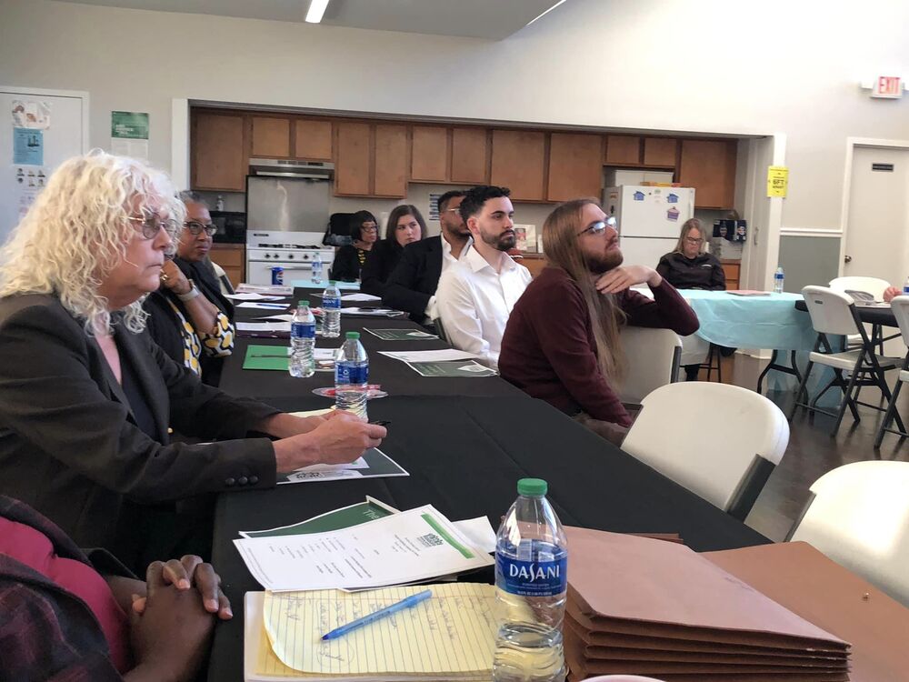 PCC meeting attendees listen to presentations.