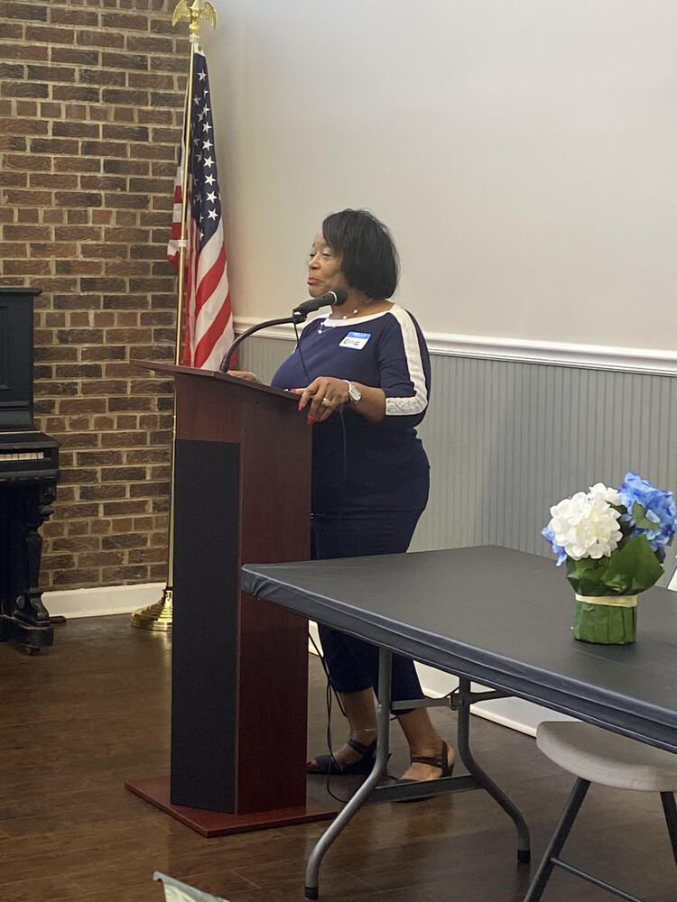 Lady speaking at the Women's Event.