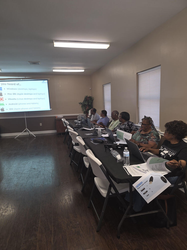 Participants learning at computer class