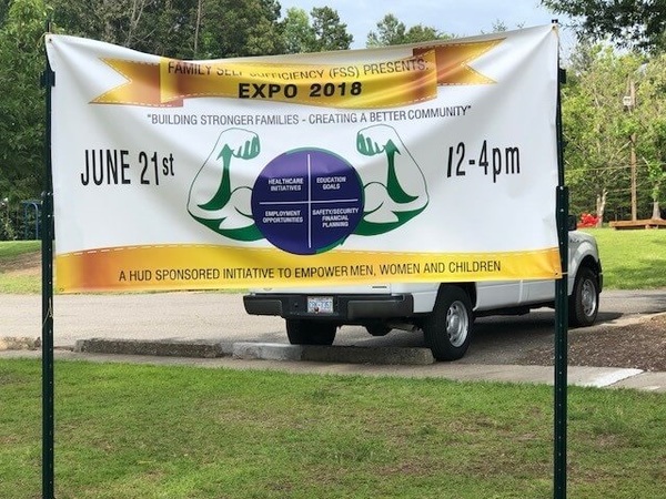 Large white banner for the Family Self Sufficiency Expo
