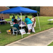 People talking by a table.