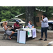 People at the 4H table talking to a visitor.