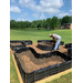 Garden containers with dirt and mulch.